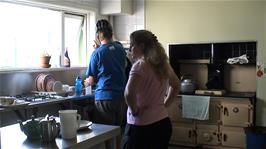Gavin fills his water bottle in the kitchen at Dunquin Youth Hostel